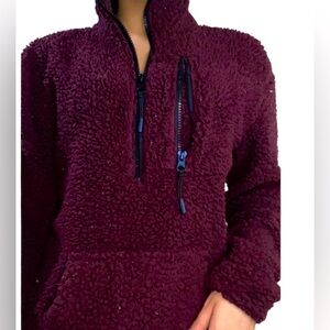 Warm maroon color jacket with pockets